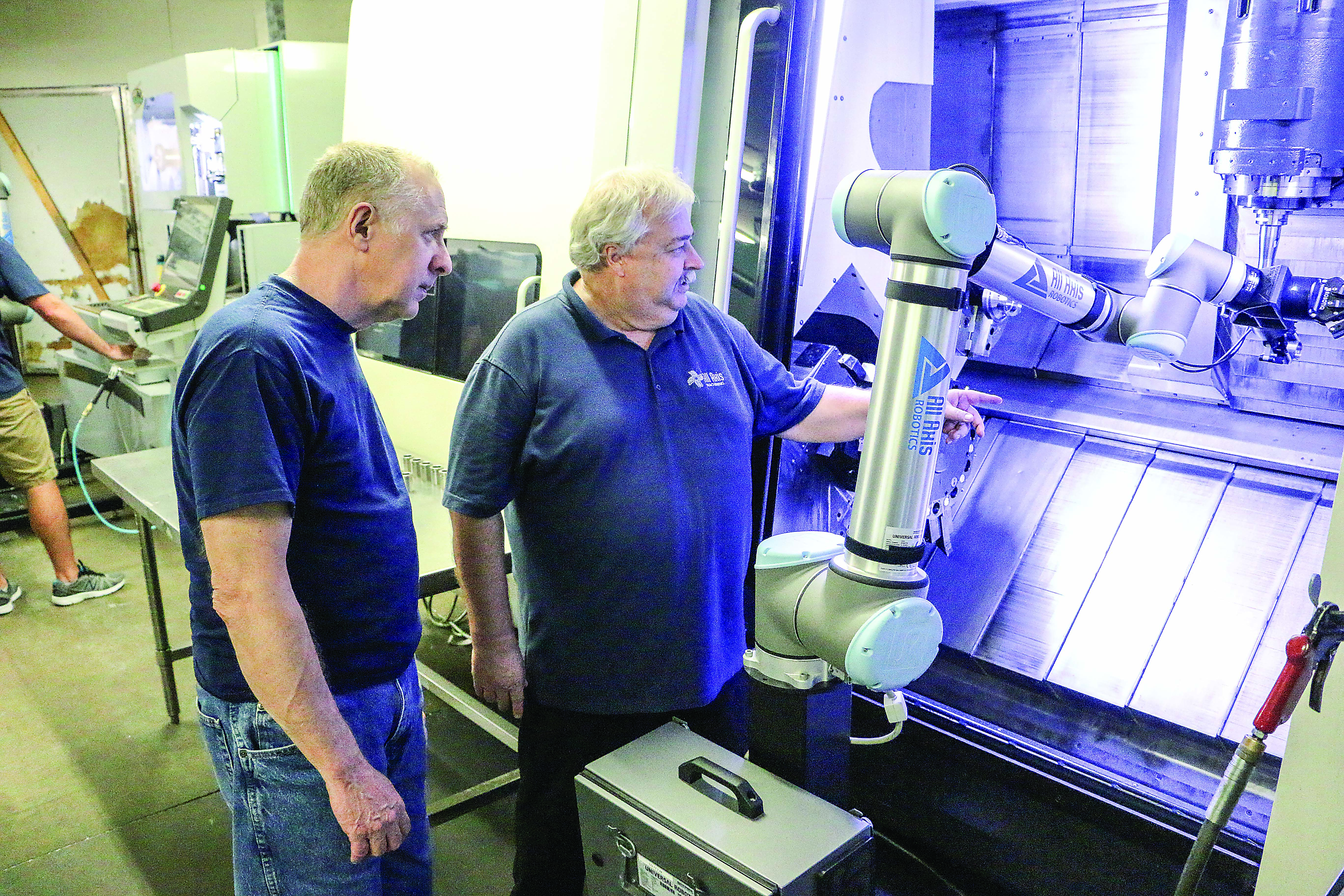The open architecture of Universal Robots’ cobot arms enabled All Axis Machining Inc. to automate six different operations. Photo credit: Universal Robots USA
