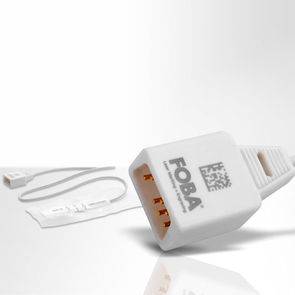 Medical device plastic accessories with laser marked UDI codes.
