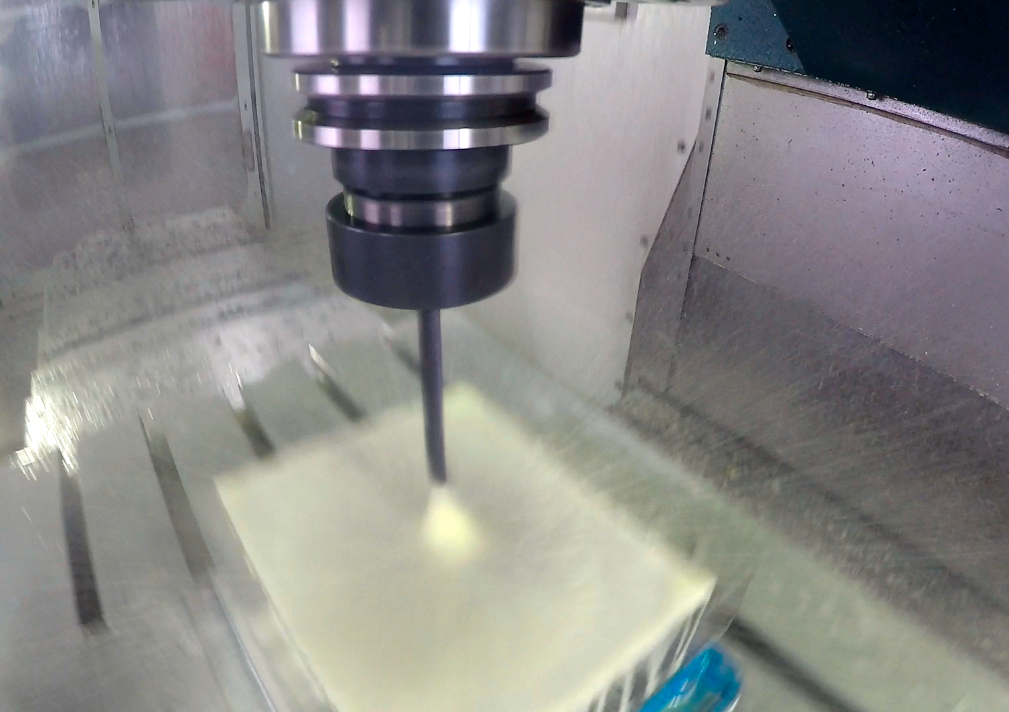 The ROMI D1000AP channels coolant through a high-speed carbide drill bit to flush out chips. 