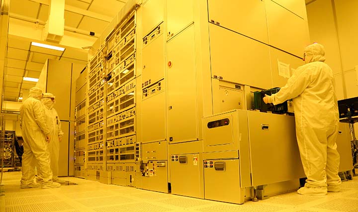 Clean room technicians working at the Albany NanoTech Complex chip fabrication facility in New York are an example of advanced manufacturing.