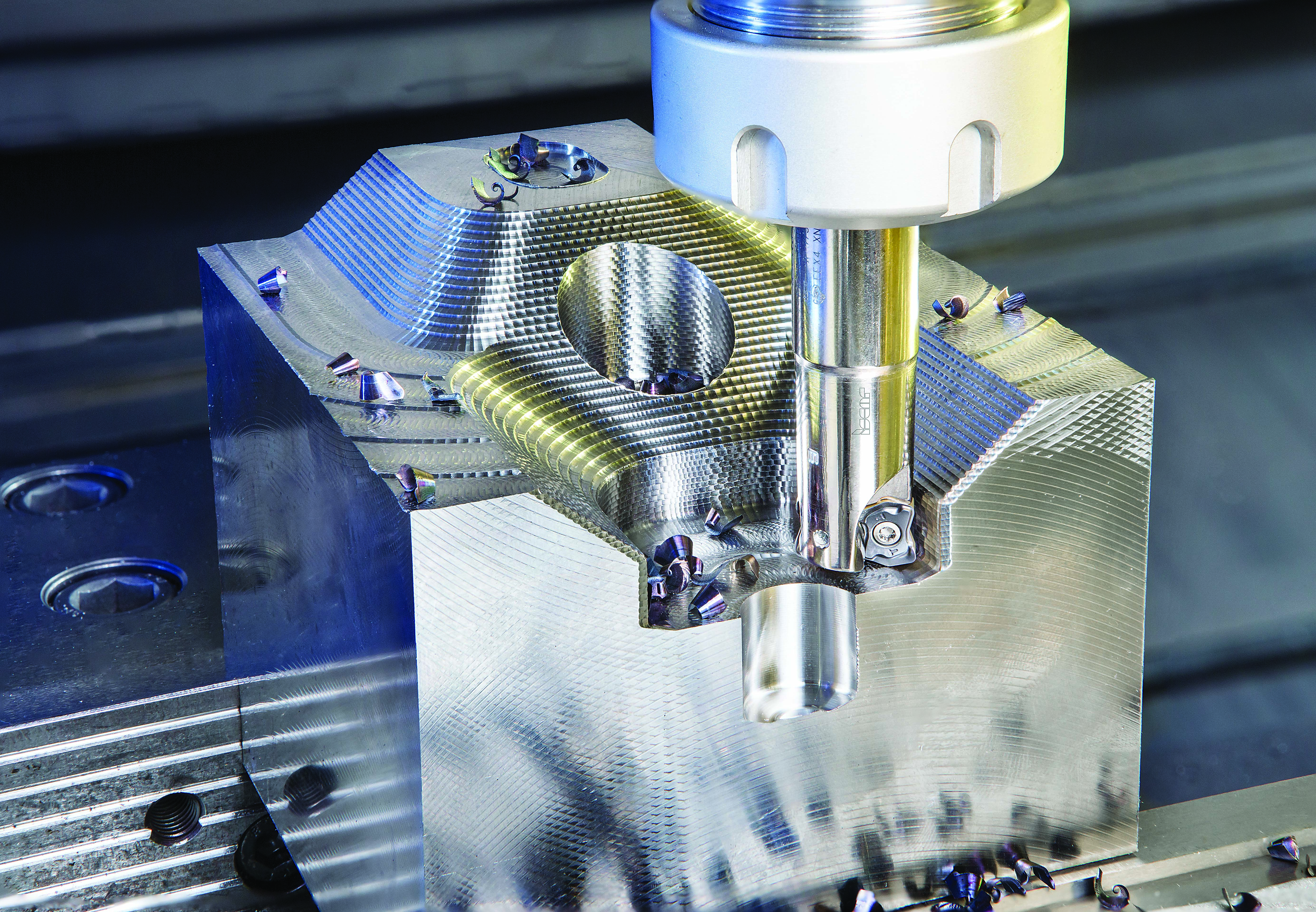 FFX4 ED endmills carry small, double-sided, “bone-shaped” inserts with four cutting edges for fast feed milling.