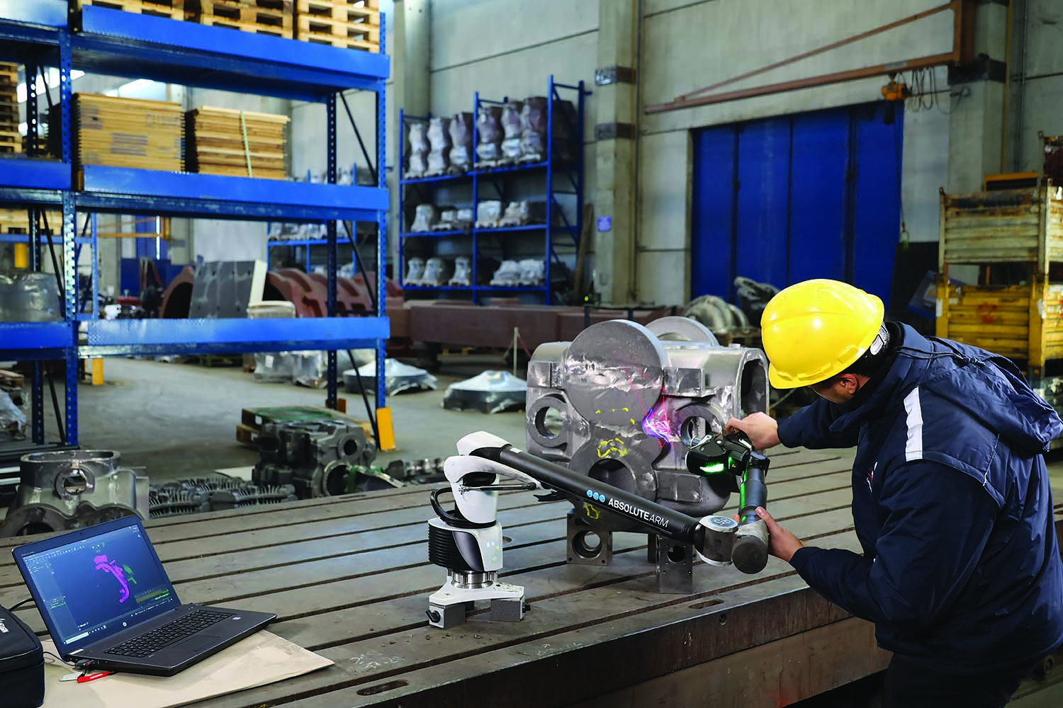 The Absolute Arm AS1 portable CMM is used on a shop floor.