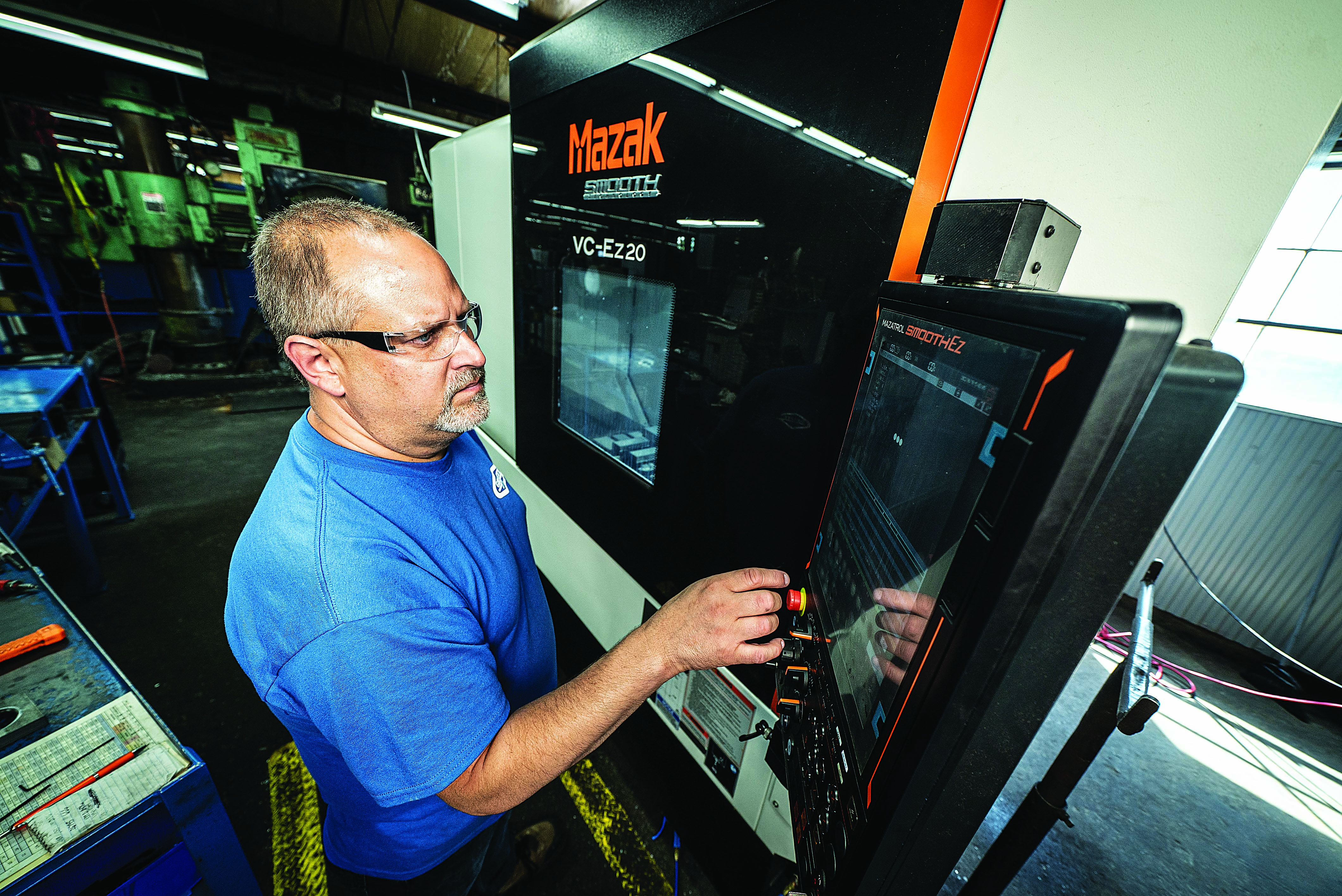 Chad Kanzelberger, CNC machinist for milling at Graetz Manufacturing, operates a VC-Ez 20 three-axis vertical machining center.