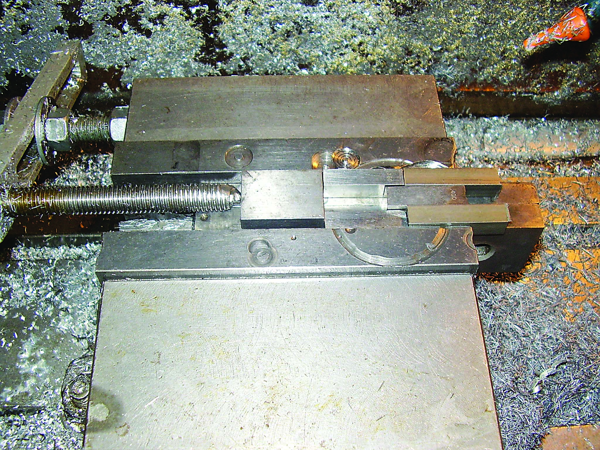 This photograph shows all the pieces in the vise to set the position of the key blanks.