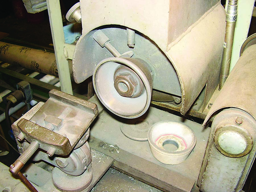 The cutter grinder is used to modify inserts.