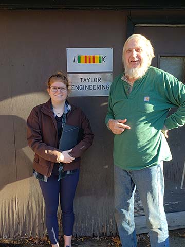  Brandt Taylor stands with Machinist Olivia Porter, whom he describes as a “computer wiz.”