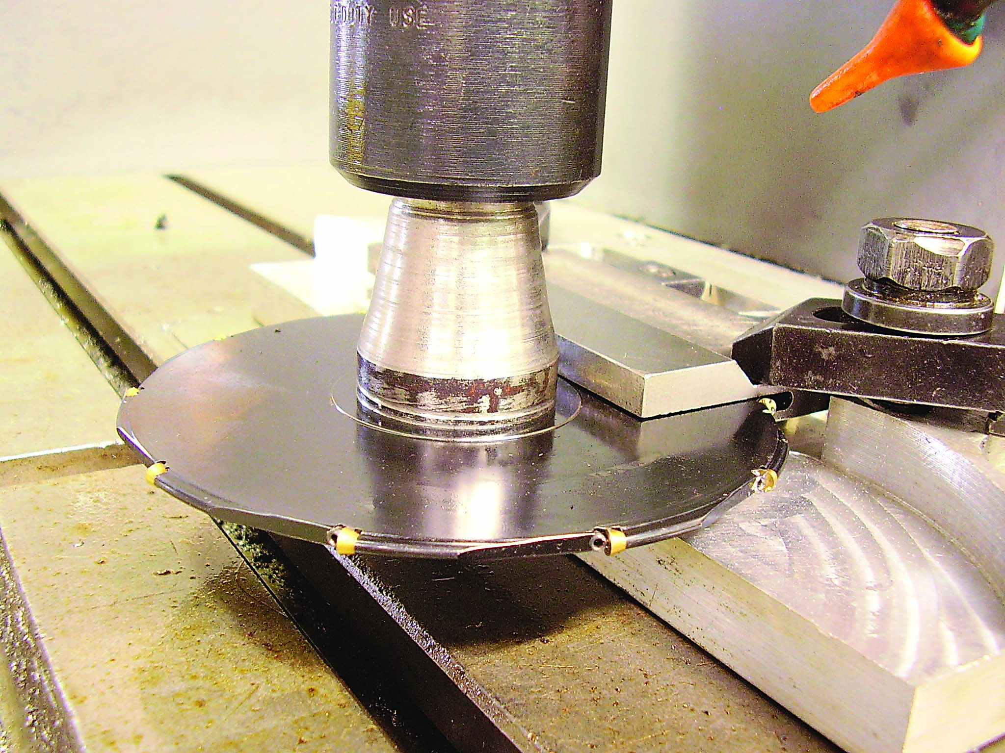 The machining setup is shown above with the cutter in the slot.