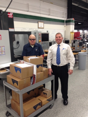 Jim Filipek (left) and Mike Grzybowski with donated OSG tooling at the College of DuPage's machine shop. 
