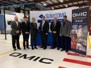 Sumitomo President Kazuyoshi Kimura shakes hands with OMIC R&D Executive Director Craig Campbell Sumitomo Electric Carbide joins OMIC R&D as 30th member