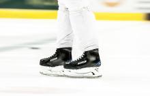 A pair of Bauer skates are taken onto the ice Ice hockey's elite steel edge