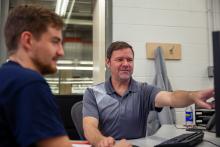 Blum apprenticeship trainer Jim Neal works with a student at the company’s factory in North Carolina Blum apprenticeship trainer Jim Neal works with a student at the company’s factory in North Carolina