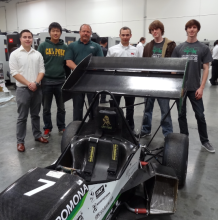 Cal Poly Pomona Engineering Students with Engineering Director Clifford Stover and SMTCL service technician Nathan LeMaster (3rd and 4th from the left) stand by one of the vehicles that Cal Poly Pomona will enter into competition. (Photo taken at SMTCL's Los Angeles Technical Center) Cal Poly Pomona Engineering Students with Engineering Director Clifford Stover and SMTCL service technician Nathan LeMaster (3rd and 4th from the left) stand by one of the vehicles that Cal Poly Pomona will enter into competition. (Photo taken at SMTCL's Los Angeles Technical Center)
