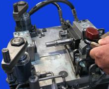 Compact fixturing with hydraulic swing clamps & block cylinders Compact fixturing with hydraulic swing clamps & block cylinders