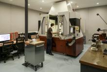 Watchmaker manufactures small parts with a high-precision machine tool