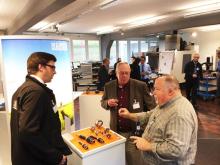 David Stucki, Marketing Manager at KAISER Switzerland, discusses new Kaiser products with U.S. guests at the recent open house.