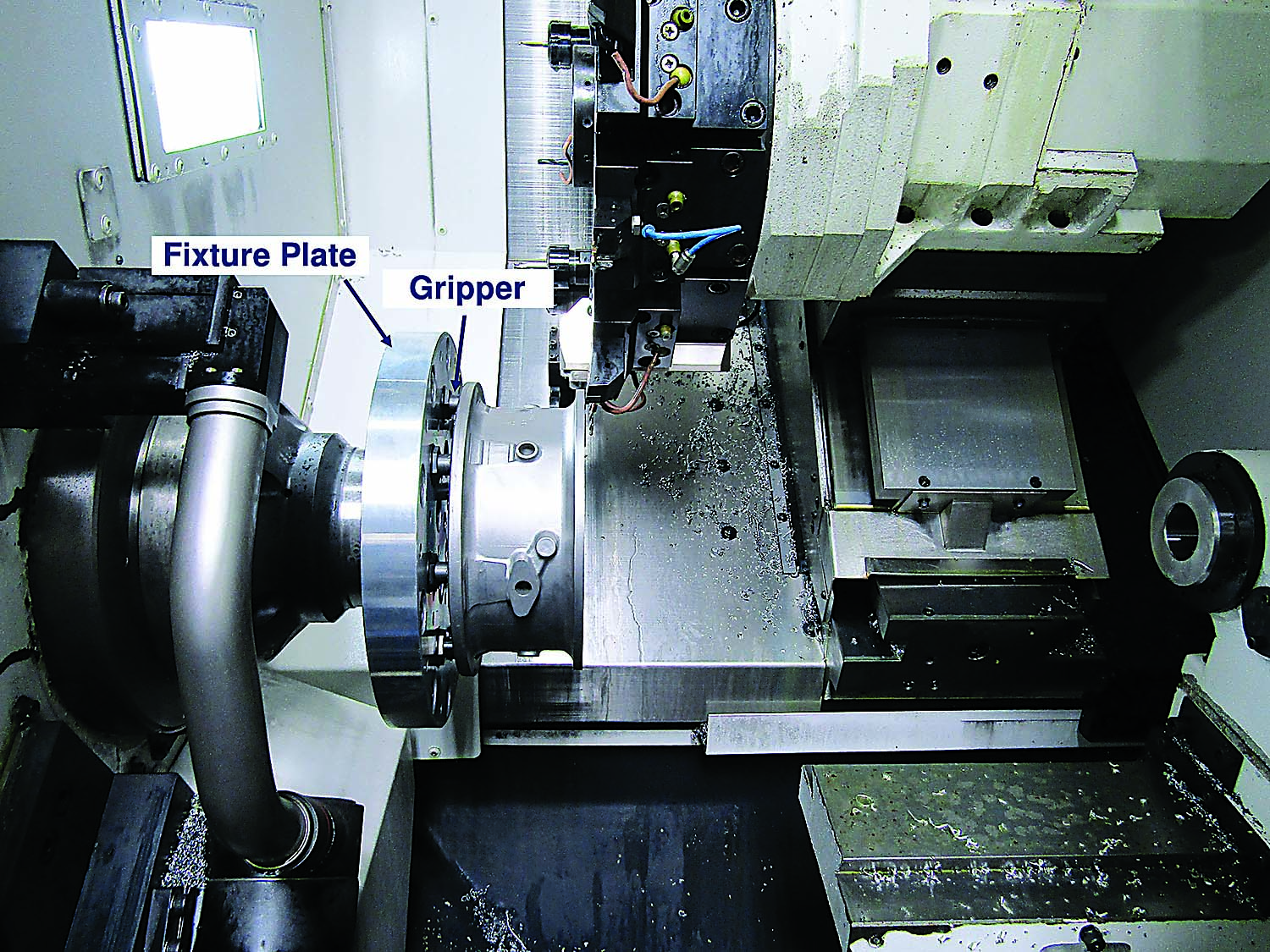 The photo-curable adhesive and patented gripper system is strong enough for a variety of machining applications. Photo credit: Blue Photon Technology and Workholding Systems