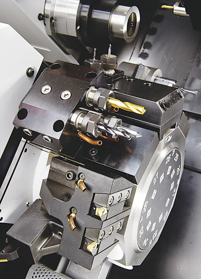 Turrets offer excellent rigidity, flexibility and tool selection. Here, dozens of tool positions are available on the twin turrets of this Cincom M-series Swiss-style CNC lathe.
