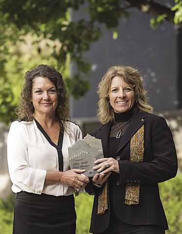 Alicia Svaldi (left), president of Faustson Tool, and Heidi Hostetter, vice president, with the company’s Platinum Supplier for 2014 award from Ball Aerospace.