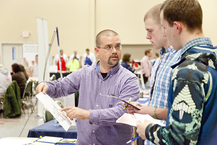 Matt Schowalter (left), developer of machiningcareer.com, discusses machining with students at a career fair. Image courtesy Matt Schowalter.