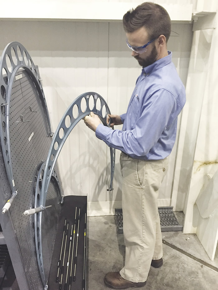 Joel Johnson, a quality engineer at Mitsubishi Hitachi Power Systems, checks calibration stickers on large micrometers used to measure the journals of gas turbine rotors. All images courtesy C. Tate.