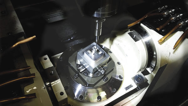 Full 5-axis contouring, as well as 3+2 positioning, of microparts is possible on this this tilt-rotary-equipped Microlution machining center. Image courtesy Industrial Machine Works.