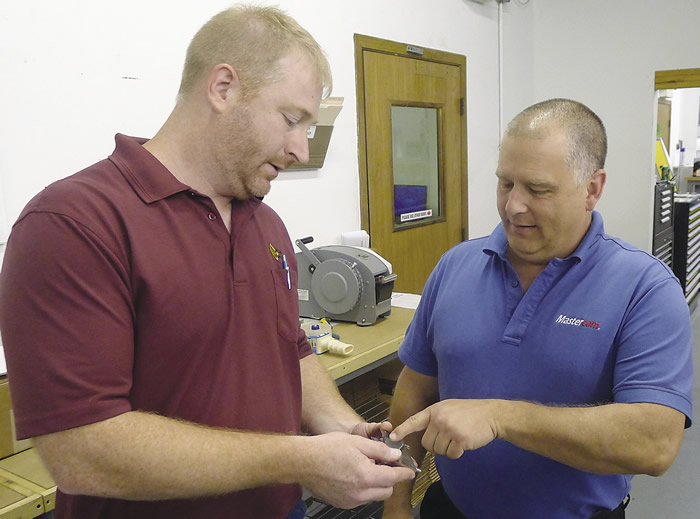 Joe Kluba (left), owner of Kluba Machine, works with Mark Clark, applications engineer for Mastercam reseller QTE Manufacturing Solutions, St. Charles, Mo., to help resolve a CNC machining issue.
