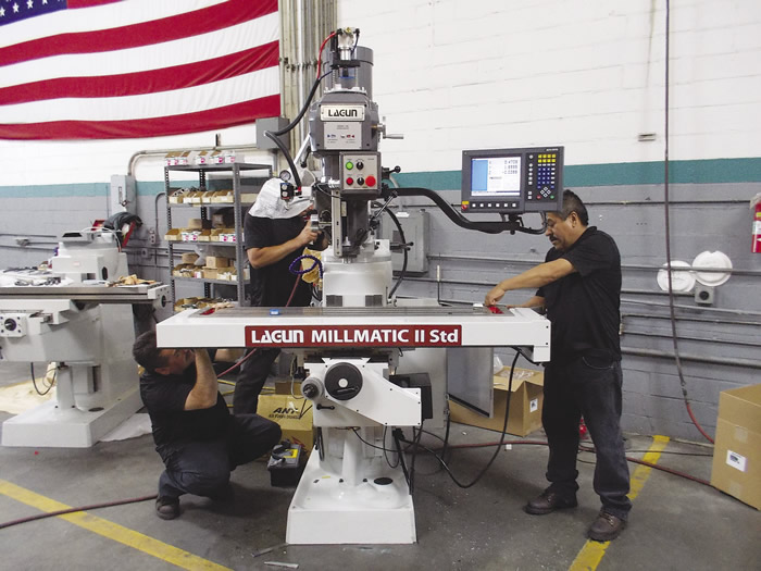 A Lagun combo CNC knee mill gets some finishing touches before shipment. Image courtesy Lagun Engineering Solutions.