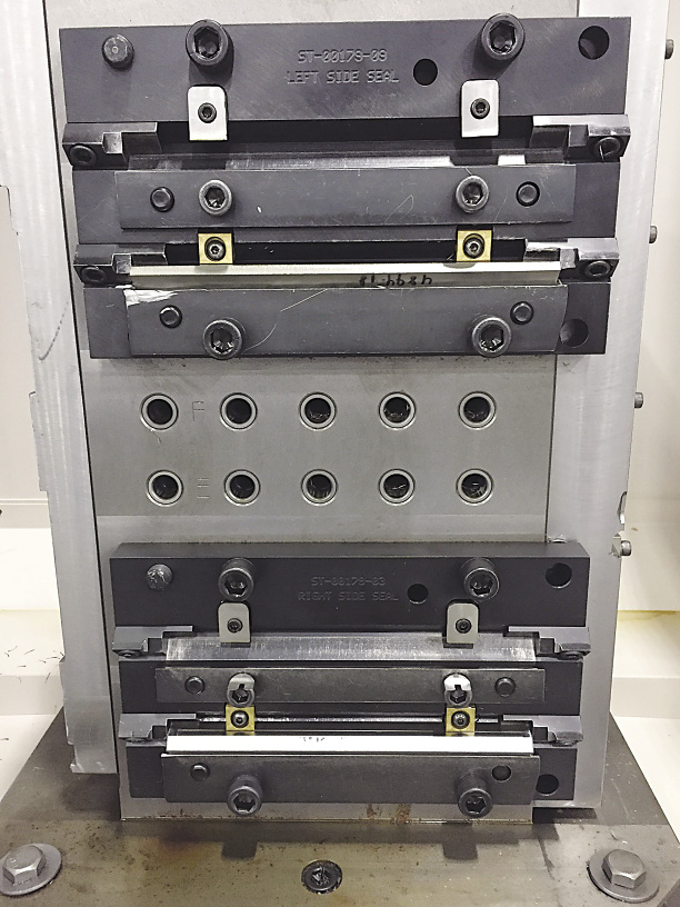 A tombstone on a horizontal machining center at Mitsubishi Hitachi Power Systems Americas’ machine shop is an example of a fixture that can be used on all machining centers, including verticals, because it has a common locating pattern.