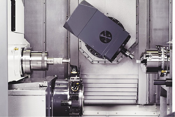 Some multitask machines, such as the Nakamura-Tome NTMX from Methods Machine Tools, use a machining center-style B- and Y-axis milling head with a toolchanger in lieu of an upper turret. Image courtesy Methods Machine Tools.