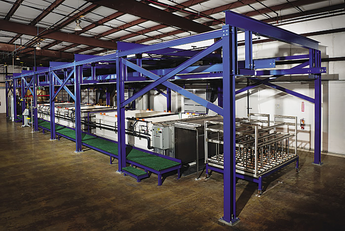 This passivation line is automated and capable of processing thousands of parts per day. Image courtesy PKG Equipment.