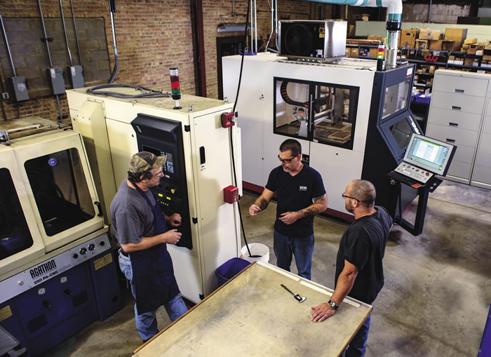 Left to right: Mark Wawiorka, operator and technician; Chuck Best, CNC operator and technician; and Dan Quinn, operations manager; discuss setup and operation of Illinois Carbide Tool’s two Agathon grinding machines: a 250 PA-CNC Ultra (foreground) and a Leo Peri.