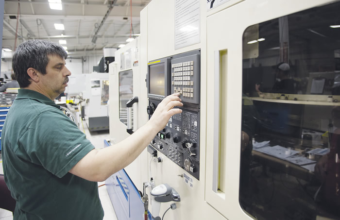 Manufacturing manager John Donajkowski sets up a machining operation on Protomatic’s Tsugami TMA8 multitask turning center. Image courtesy Protomatic.
