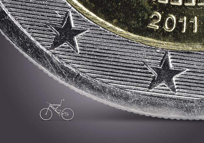 Cut by a TruMicro picosecond laser from Trumpf, this “bicycle” is dwarfed by a 2€ coin. Image courtesy Trumpf.