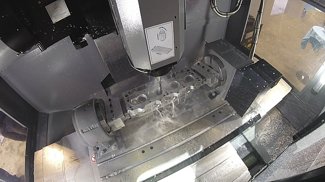 A Mast Motorsports’ part is cut on a Hurco 5-axis CNC milling machine.
