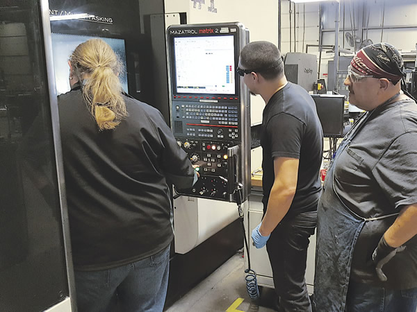 A group of students receives offset training on a Mazak Integrex machine tool. Image courtesy LeanWerks.