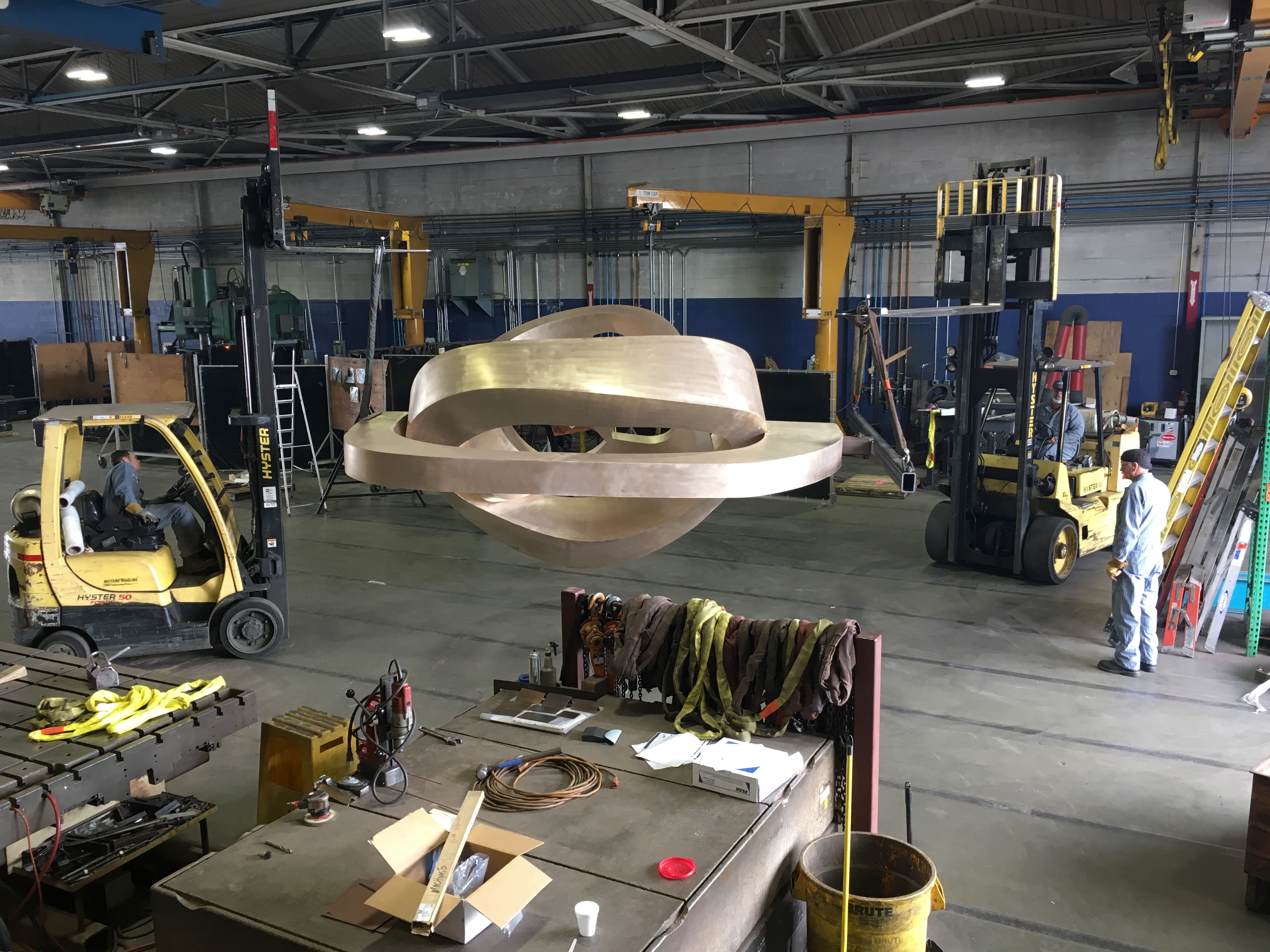 Workers at Machinists move a 14'-tall bronze sculpture conceptualized by local artist Julie Speidel before its installation in downtown Seattle last year. Photo courtesy of Machinists.