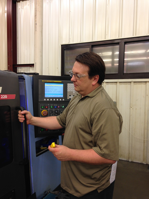 Manufacturing engineer Ian Dotson keeping an eye on machining progress with Beyond Evolution™ grooving and cut-off system from Kennametal.