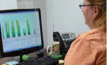 An Enoch employee using Global Shop Solutions ERP software.