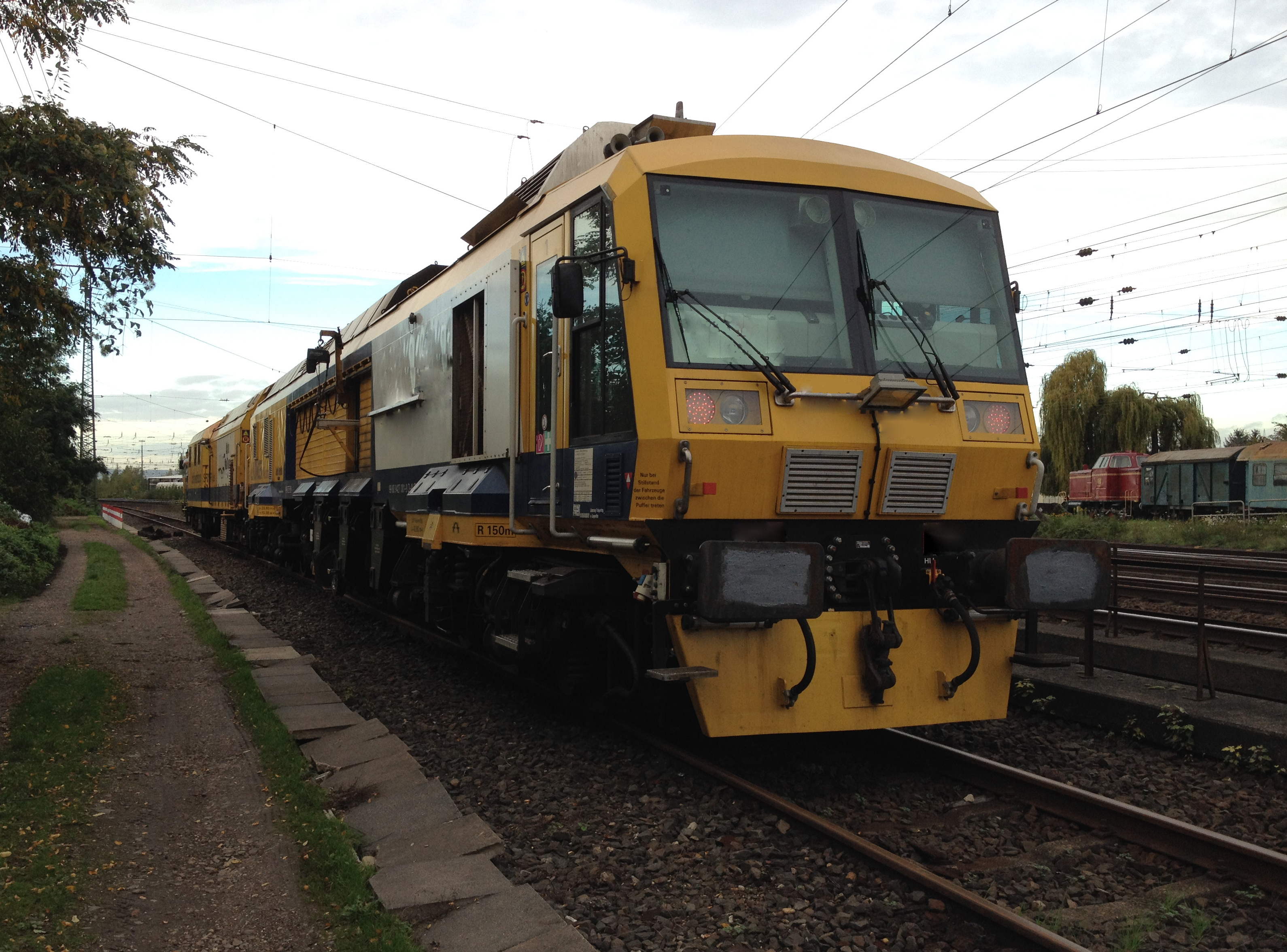 A train dynamically milling a railway line.