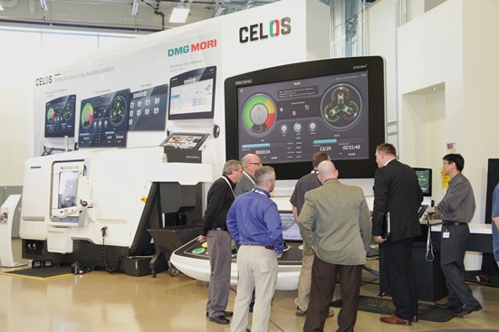 Visitors check out the CELOS model and new design of a DMG MORI NLX machine.