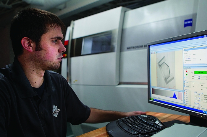 A CT scanning technician analyzes a workpiece. Image courtesy of 3D ProScan.