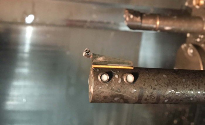 A chip became welded to an insert during blind-keyway broaching at Muthig Industries. ​Image courtesy of Muthig Industries.