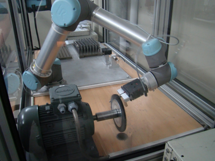 A collaborative robot from Universal Robots is used for the cutting edge preparation process. Photo by Alan Richter