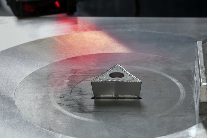 An insert is pressed during the production process at Ceratizit Reutte. Photo courtesy of Ceratizit Group