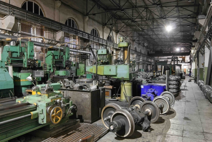 A machine sits idle in a factory.