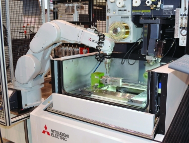 Robotic part handling is increasingly popular with job shops and others seeking to automate wire EDM processes. Image courtesy of MC Machinery Systems.